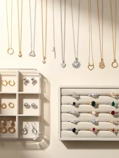 Organized jewelry collection with necklaces, earrings, and rings