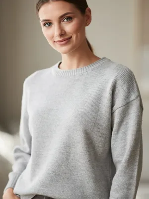 Model in a cozy, pilling-resistant light gray casual sweater