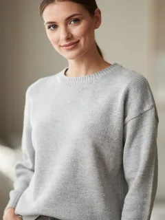 Model in a cozy, pilling-resistant light gray casual sweater