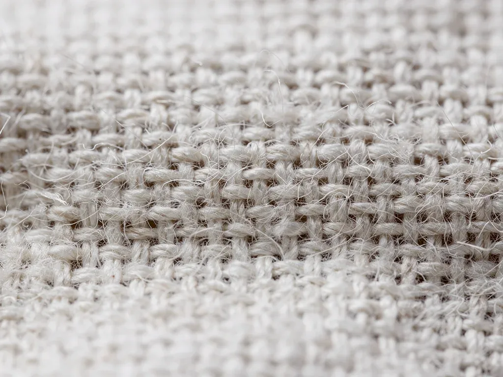 Close-up view of dense 240 GSM knit fabric showing compact textile construction