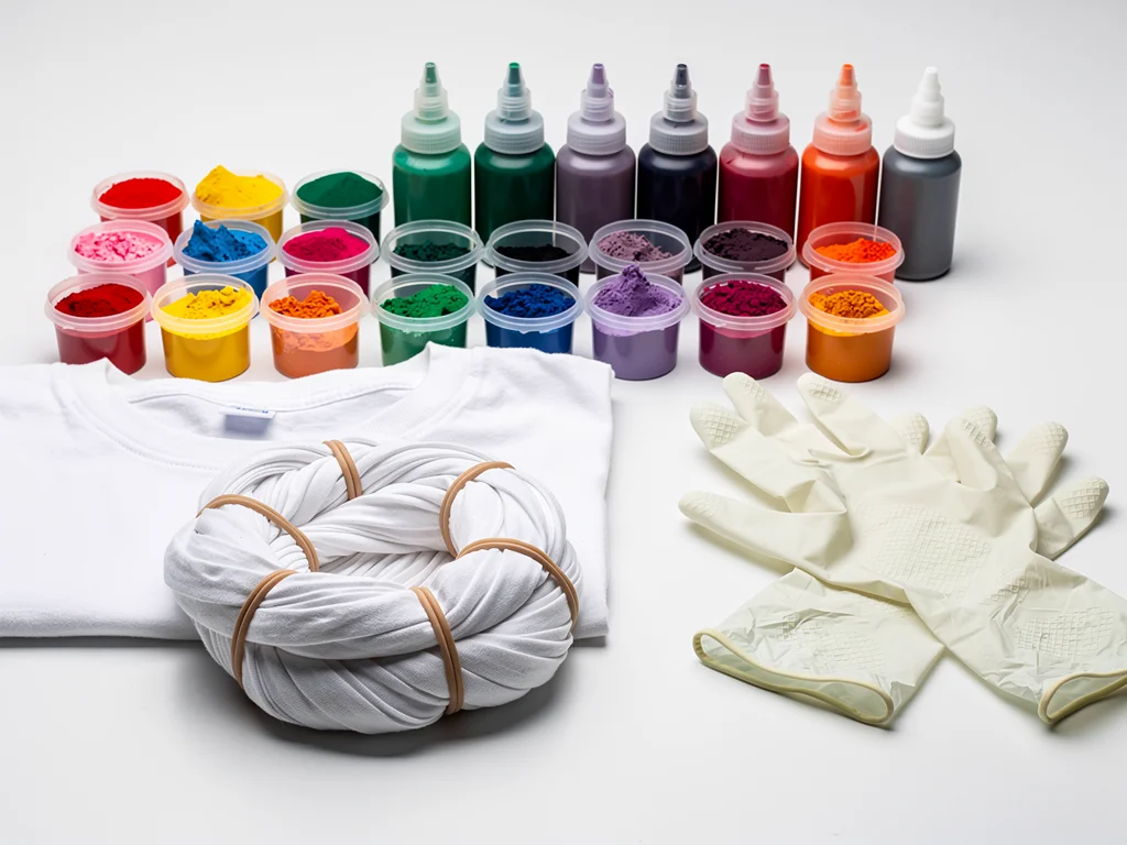 Variety of tie-dye kits and a prepared t-shirt for customization.